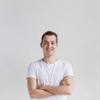 smiling-man-with-crossed-arms-looking-camera